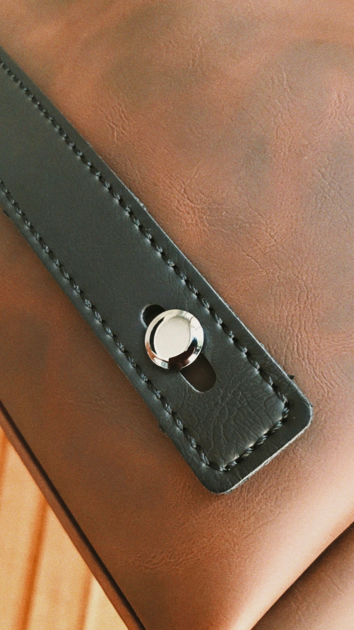 a close up of a brown leather chair