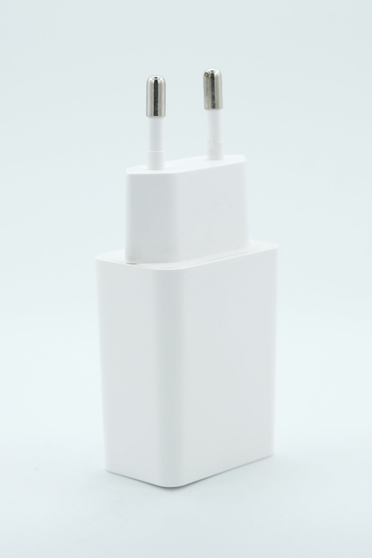a close up of an apple charger with two plugs