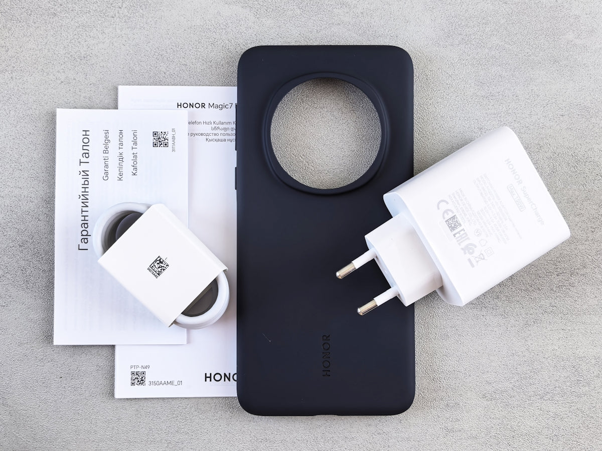 Phone, charger, case, and paperwork are displayed.