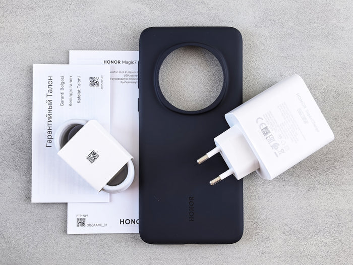 Phone, charger, case, and paperwork are displayed.