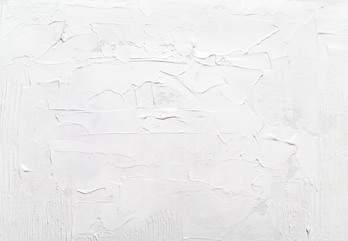 a white wall with some white paint on it