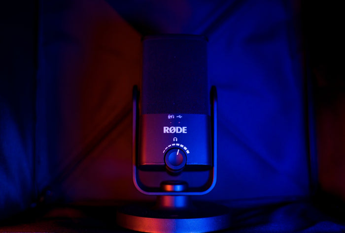 black and silver speaker on brown wooden table