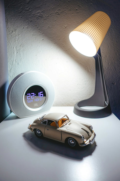 white and gray digital alarm clock