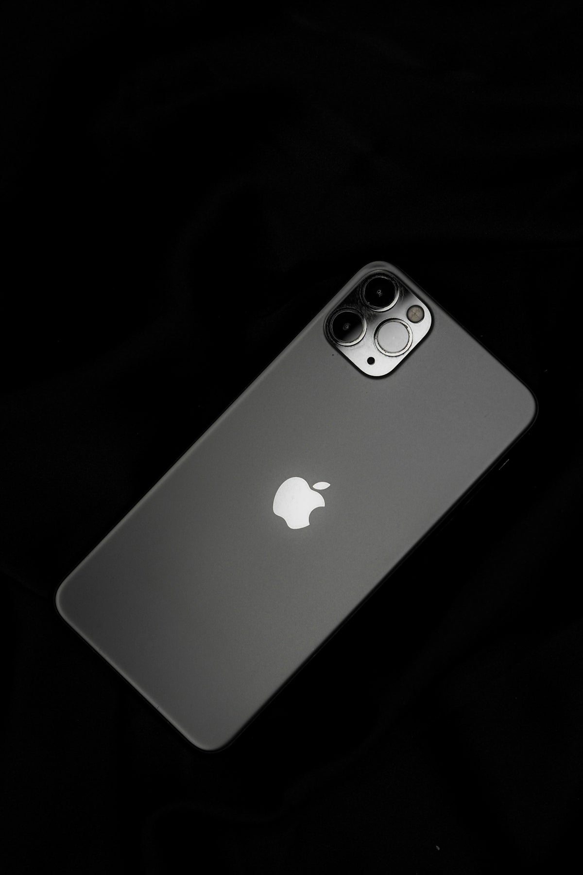 silver iphone 6 on black surface