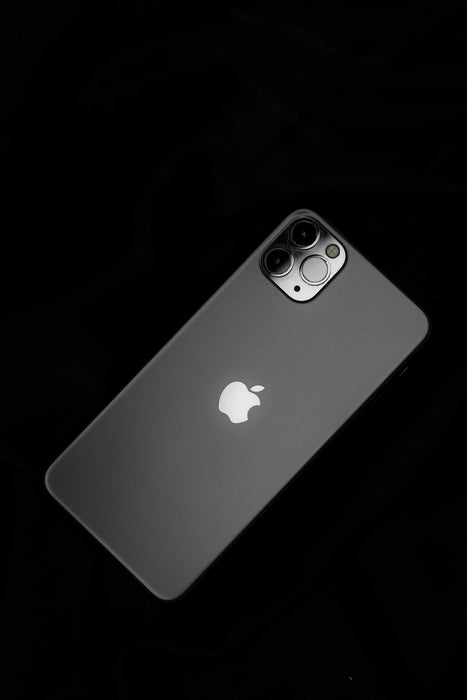 silver iphone 6 on black surface