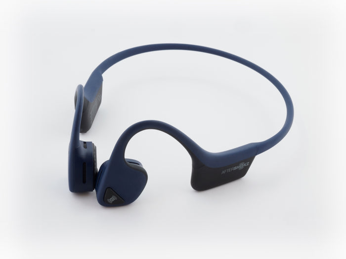 a pair of blue headphones sitting on top of each other