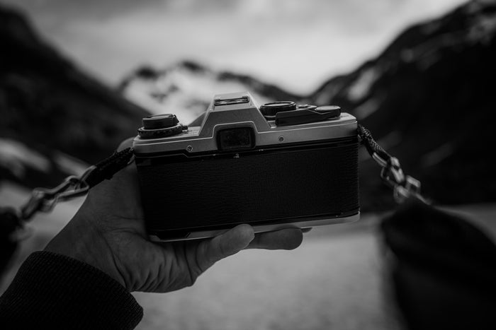 a person holding a camera in their hand