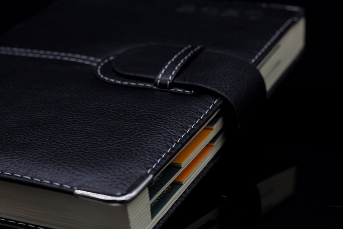 a black book with a leather cover