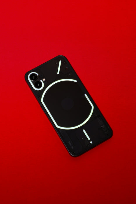 a cell phone with a neon light on the back of it