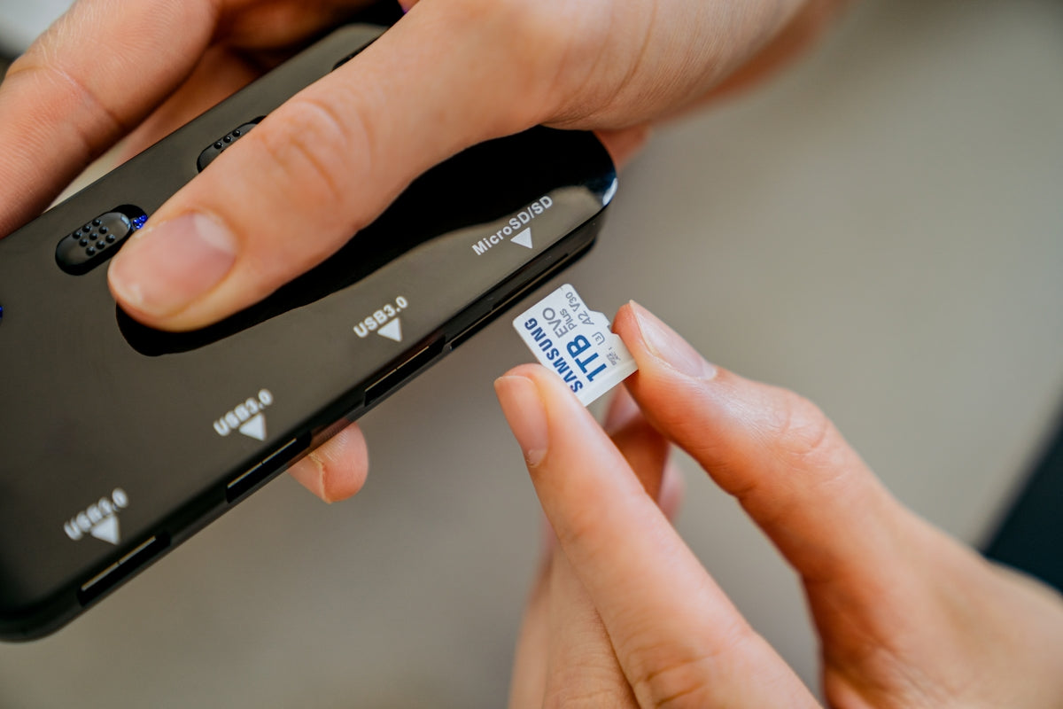 A close up of a person holding a cell phone