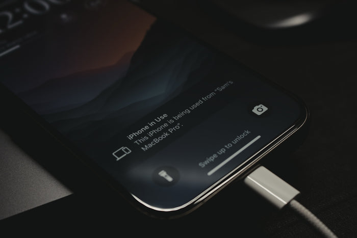 A close up of a cell phone charging