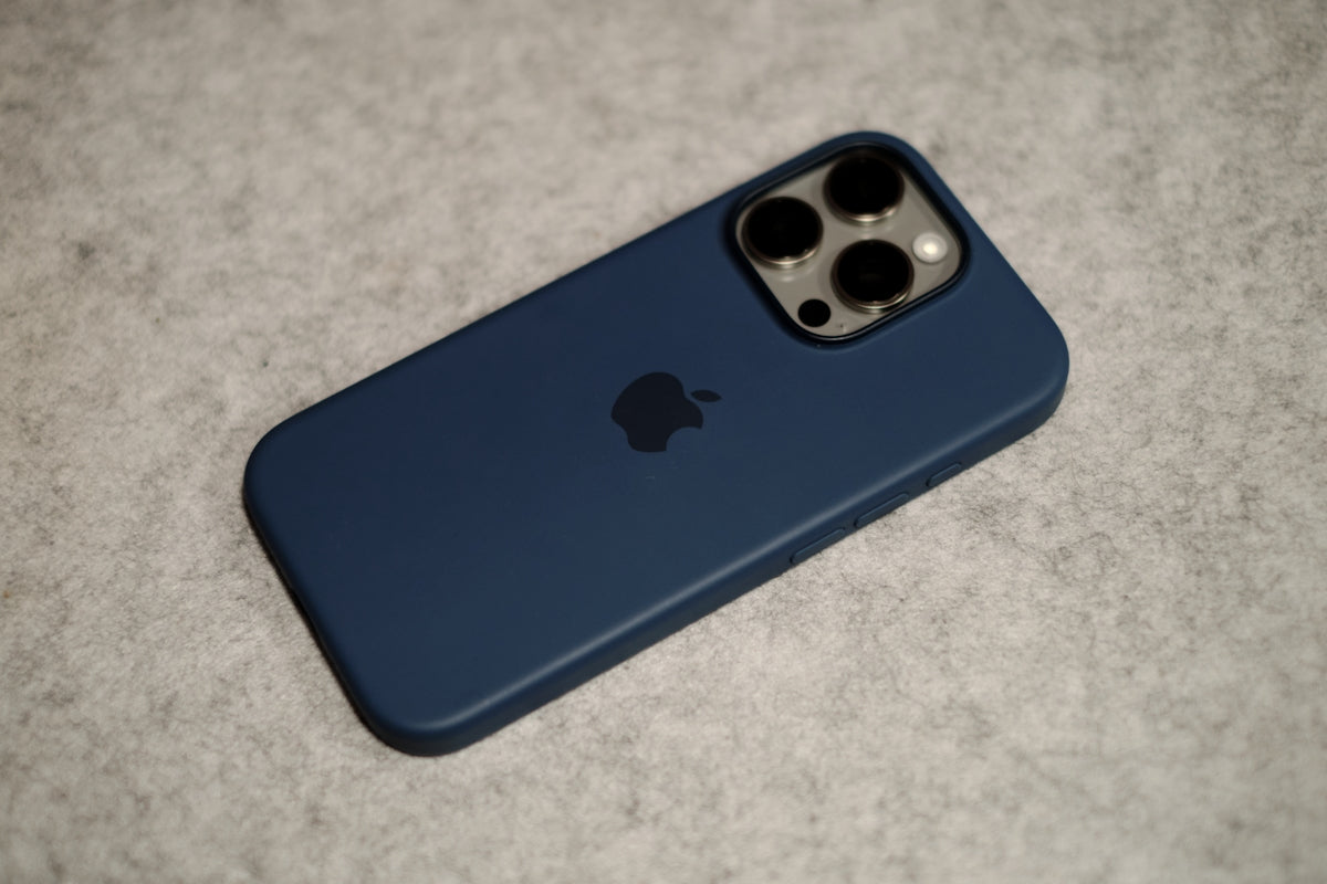 A blue iPhone case sitting on a table