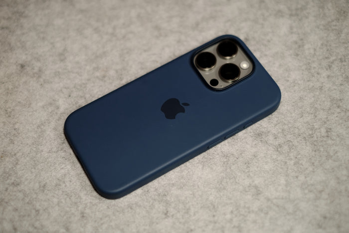 A blue iPhone case sitting on a table