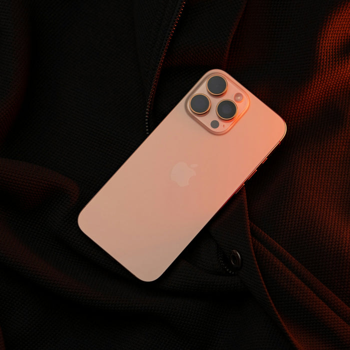 A white iPhone case sitting on top of a black jacket