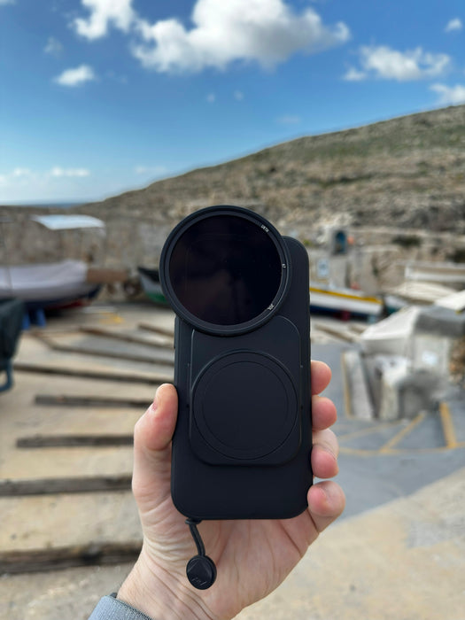 A person holding a camera in their hand