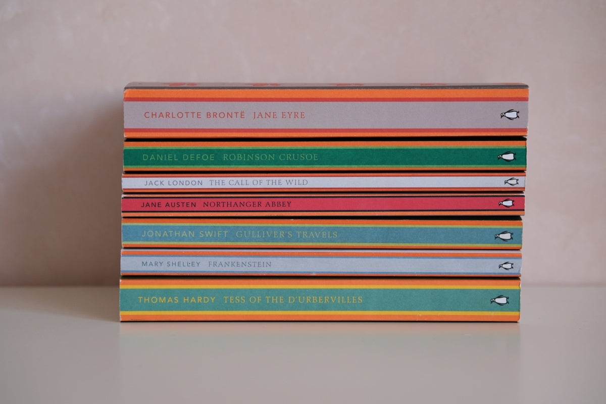 Stack of colorful books with titles visible