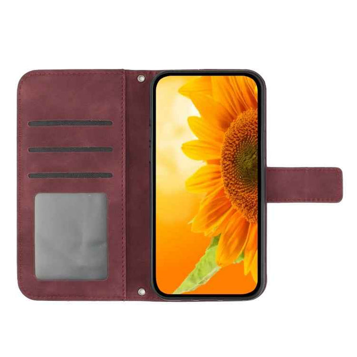 For iPhone 16 Plus Skin Feel Sun Flower Embossed Flip Leather Phone Case with Lanyard(Wine Red)