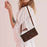 For iPhone 17 Dream Triangle Leather Phone Case with Lanyard(Brown)
