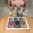 For iPhone 15 Gradient Glitter Spinning Top Holder Phone Case(Desert Gold)