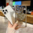 For iPhone 16 Pro Gradient Glitter Spinning Top Holder Phone Case(Silver)
