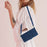 For iPhone 17 Skin Feel Heart Embossed Leather Phone Case with Long Lanyard(Blue)