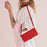 For iPhone 17 Skin Feel Heart Embossed Leather Phone Case with Long Lanyard(Red)