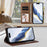For iPhone 17 Pro Max Embossed Heart Cat Leather Phone Case with Hand Strap(Brown)