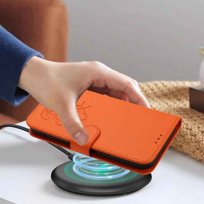 For Samsung Galaxy S25+ / S24+ 5G Embossed Heart Cat Leather Phone Case with Hand Strap(Orange)