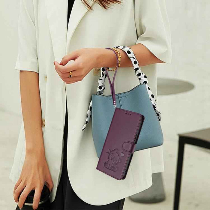 For Samsung Galaxy S25+ / S24+ 5G Embossed Heart Cat Leather Phone Case with Hand Strap(Dark Purple)