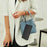 For Samsung Galaxy S25 FE 5G Embossed Heart Cat Leather Phone Case with Hand Strap(Black)